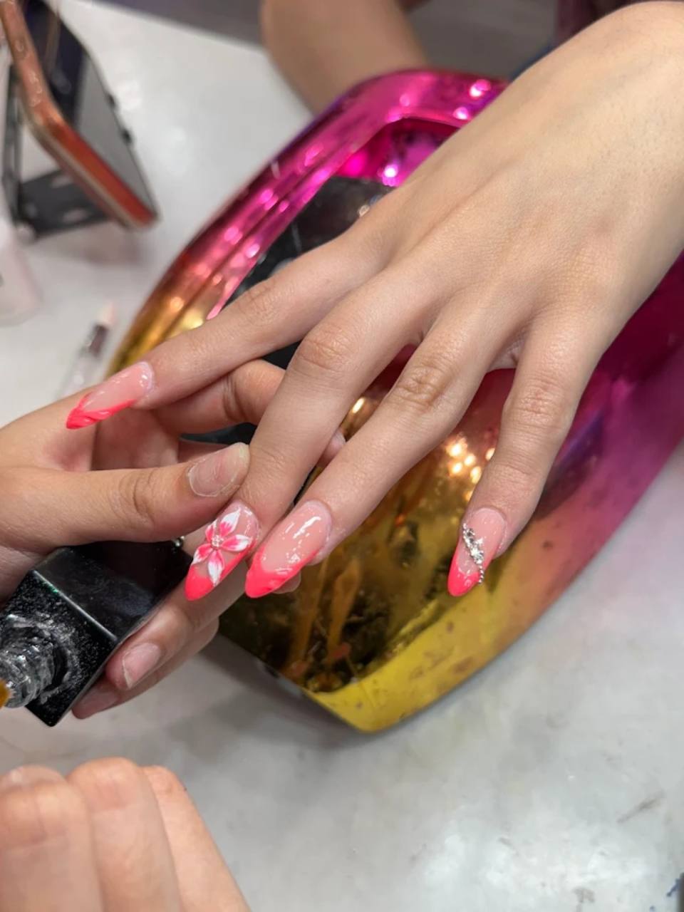 Pink floral nail art.