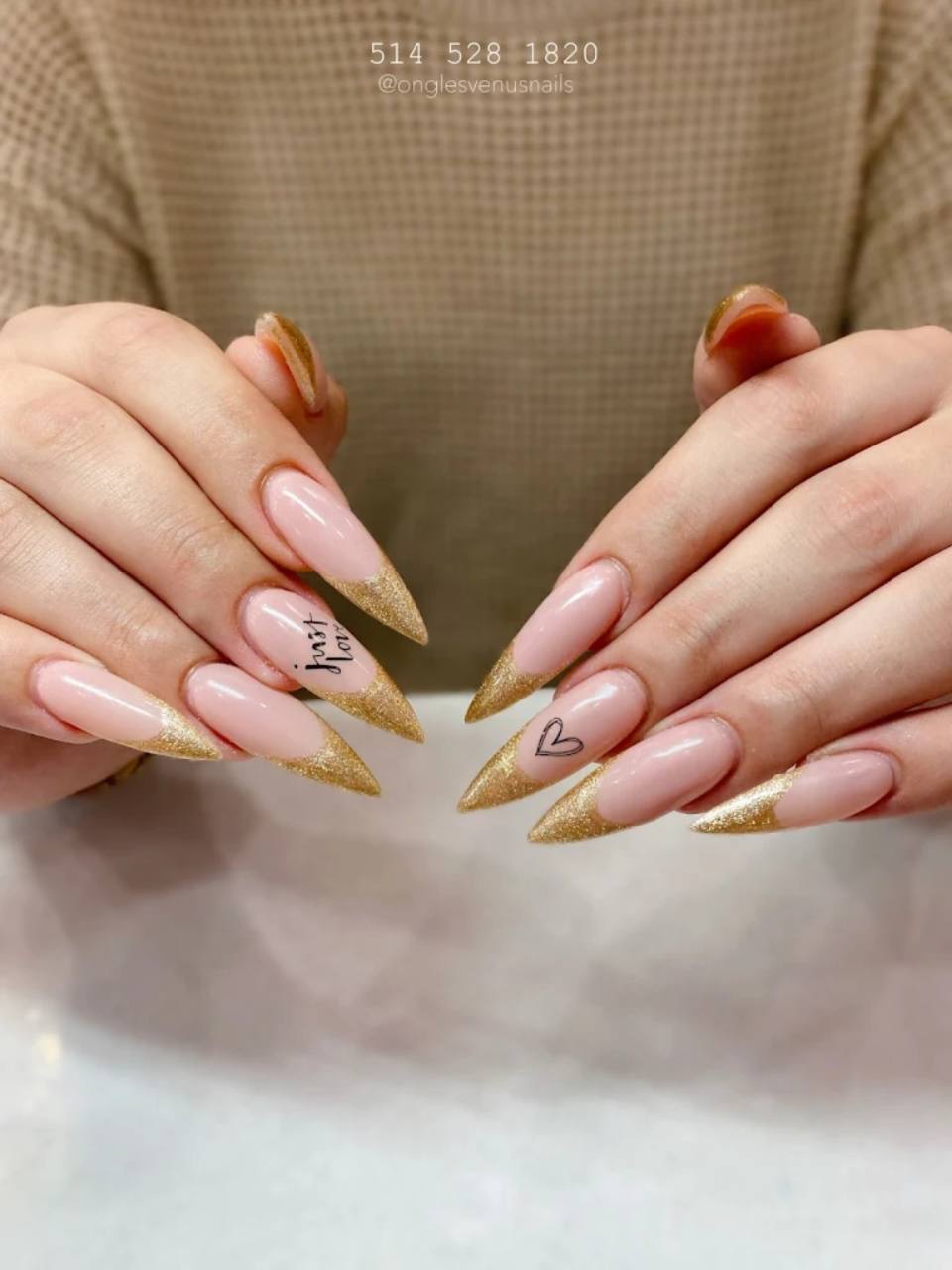 Gold French nail tips.
