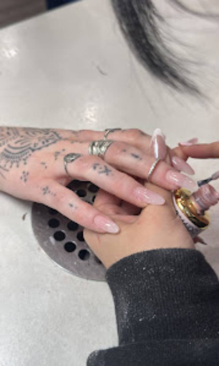 Clear French manicure with delicate rhinestones.