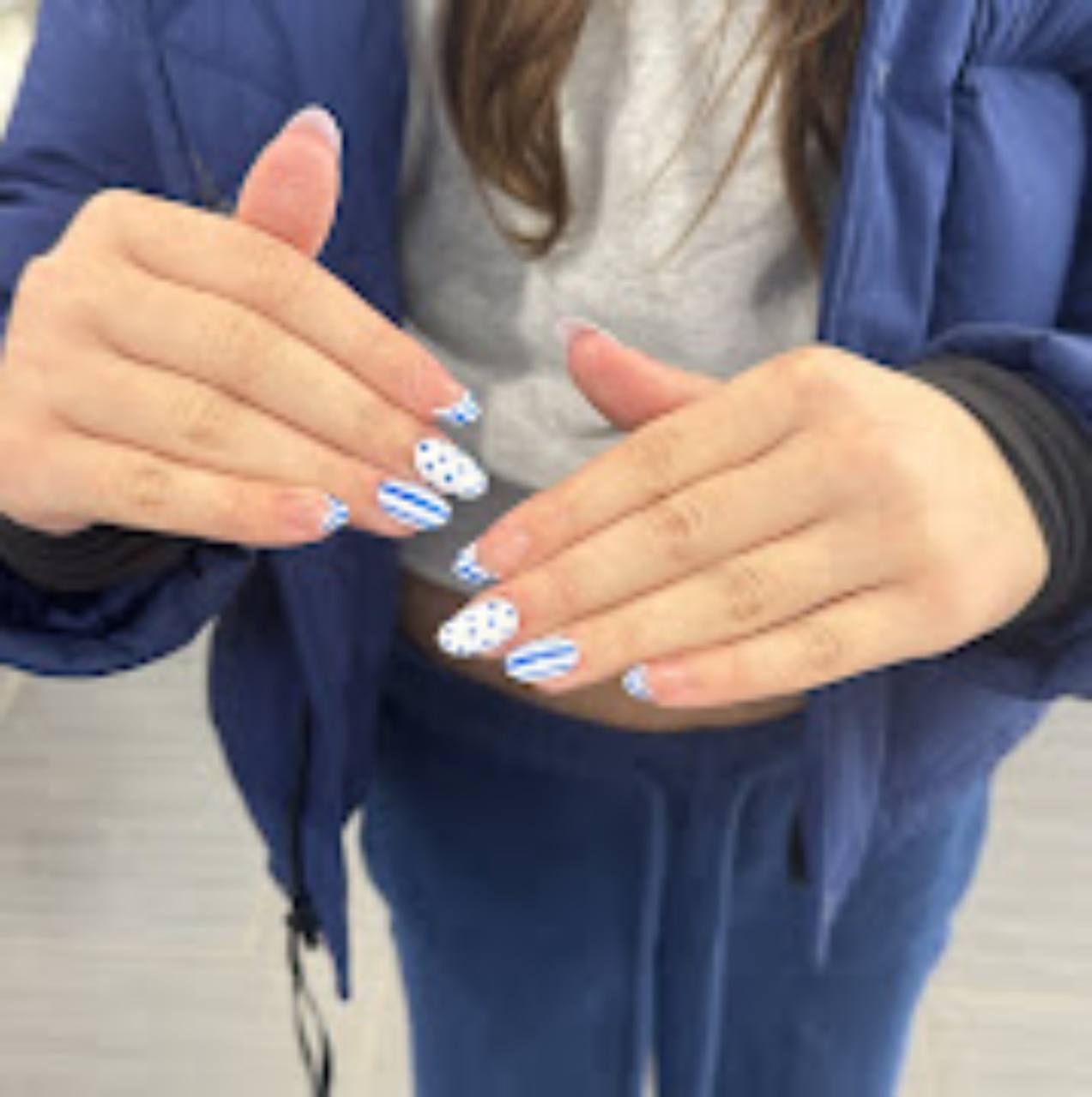 Blue and white patterned manicure.