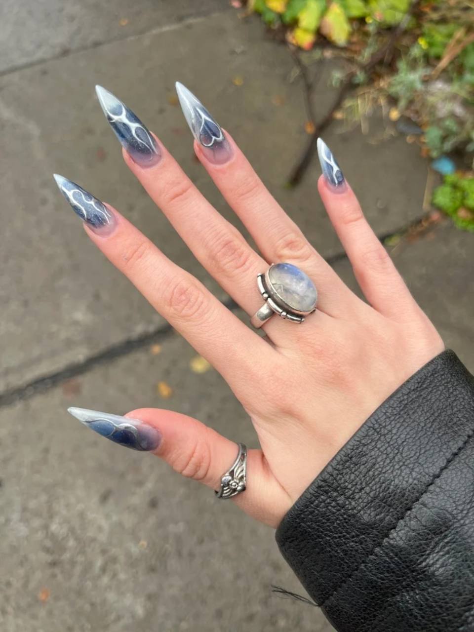 Long silver acrylic nail set.